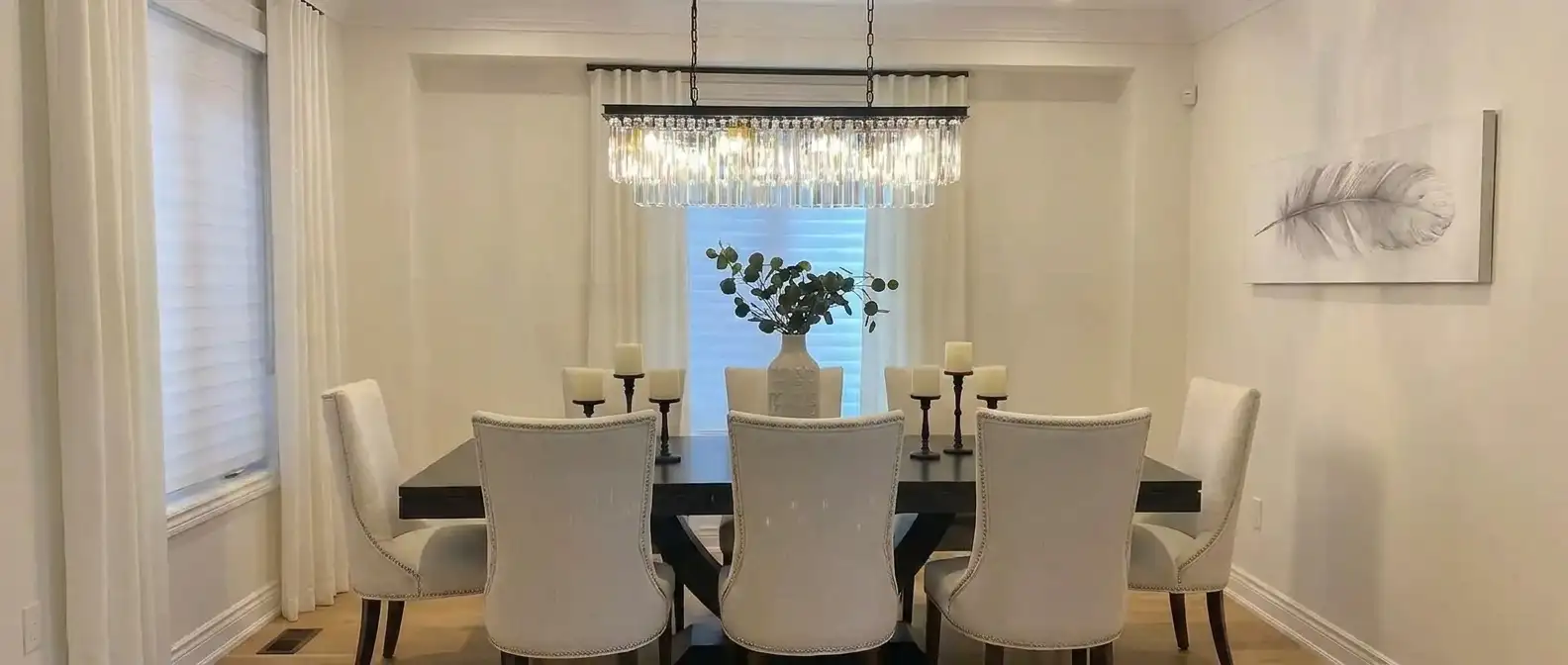 Custom Ripplefold drapery layered over zebra shades mounted high to ceiling
