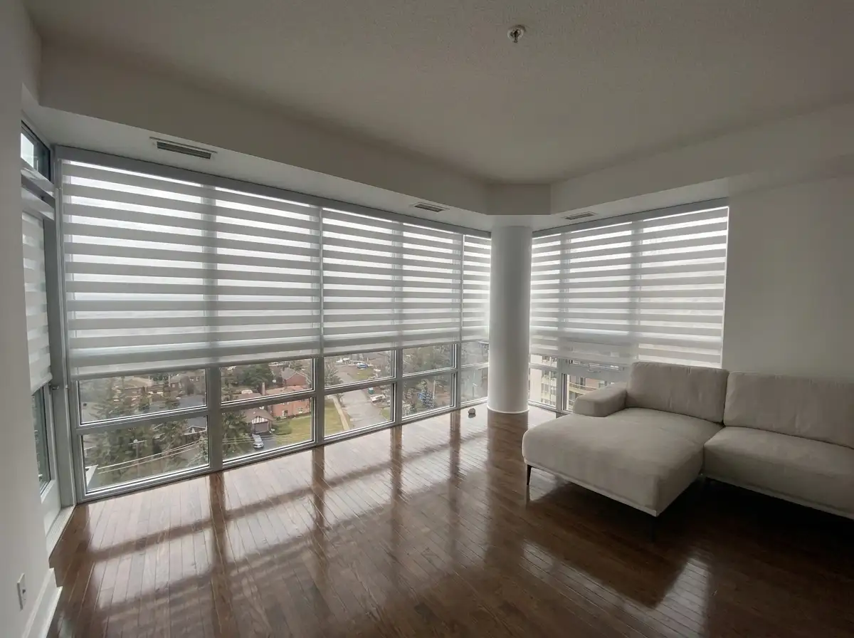 Tone on tone layered window treatments in a luxury Toronto primary bedroom